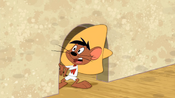 Speedy Gonzales comes out of his mouse hole.