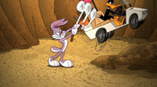 Bugs hits Daffy out using a golf club.