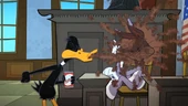Daffy spits soda on Bugs in the courtroom.