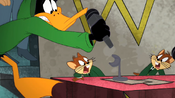 Daffy stealing the microphone from Mac and Tosh.