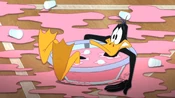 Daffy accidentally falls into the fruit punch.