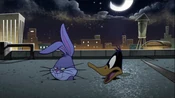 Bugs and Daffy's faces are seen above the building.