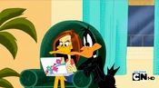 Daffy nosily watching Tina write an e-mail, much to her annoyance.