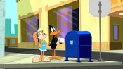 Daffy and Lola in front of a mailbox.
