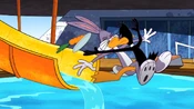 Daffy jumps in front of Bugs when he goes down the waterslide.
