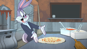 Bugs shows his employees how to make a pizza.