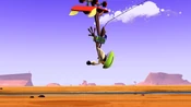 Wile E. falls from the boulder...