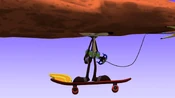 The momentum sends Wile E. into a boulder...