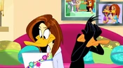 Tina about to read what Daffy said about her in the Email as the latter covers his eyes in fear.