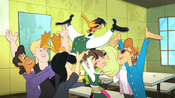 Daffy's classmates cheer and lift him up.