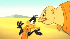 Crusher glares at Daffy for rambling.