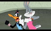 Bugs and Daffy jogging down the street.