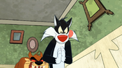 The Tasmanian Devil sneaks up behind Sylvester.