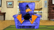 Back at Bugs' House, Daffy is watching a horror movie.