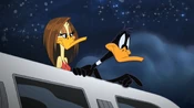 Daffy talking to Porky on from the limo.
