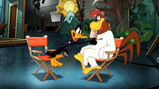 Daffy learning about Foghorn's life.