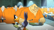 Crusher eats next to Daffy and Bugs in the jail cafeteria.