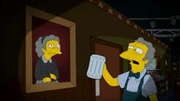 Moe Szyslak mirando con tristeza el retrato de su mamá