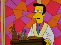 El reverendo dando el sermón.