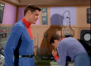 john and don examine a sample of the giant pea pod- colourised by pelham cort