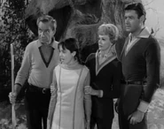 Penny is horrorstruck that the boy cannot come through the broken mirror.