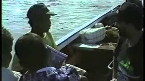 Venezuelan_fisherman_discussing_dolphin_as_shark_bait_in_1993