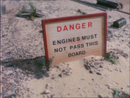 The warning sign that says "ENGINES MUST NOT PASS THIS BOARD"