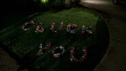 Hurley and Johnny write "Cluck You" in garden gnomes on their former boss's lawn. ("Everybody Hates Hugo")