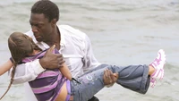  carries Emma out of the ocean