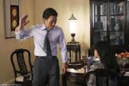 A crew member reflection in the cabinet mirror, in an unaired promotional still featuring the adult Jin and Sun