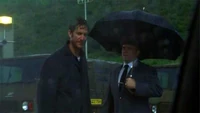  in the rain after being released from prison ("")