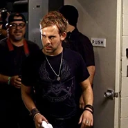 Mario Perez appears backstage behind Charlie ("The Moth")