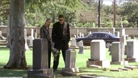  and his associate in front of his BMW at Cooper's funeral