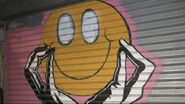 The smiley face used in the teaser for Motives' scrapped cover of the song.