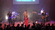 Najoua and band playing live.