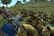 A squadron of Kataphrakt heavy cavalry, supported by heavy infantry, overrunning a Gondorian position.