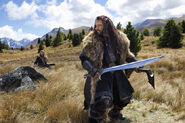 Thorin ready for battle, holding both the sword Orcrist and his axe.