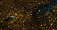 Smaug under his treasure with his scales in blue color