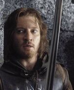 Faramir hiding to ambush Orcs invading Osgiliath, in The Lord of the Rings: The Return of the King