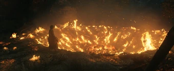 The fiery crater made by the Stranger's arrival