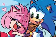 Amy hugs Sonic after they find her hammer