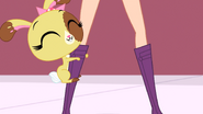 Buttercream holding onto Blythe's leg.