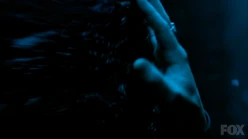 Lucifer's hand against the walls of black rock