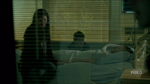 Malcolm's wife and son at his side as the nurses pull the plug