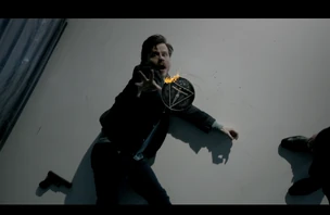  tries to grab the  as it burns away.