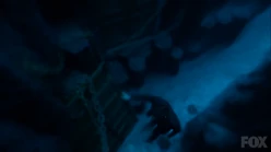 Lucifer approaches the open cell