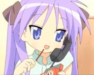 Kagami on the phone with Pocky sticks