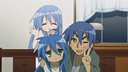 Konata taking a picture with Sojiro (and her mother's spirit watching on).