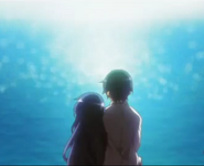 Kanata and Sojiro sitting beside each other looking into the sea