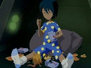 A kid letting his fuzz ball eat chocolate.